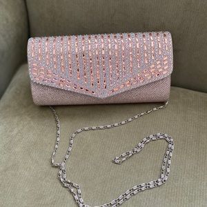 Silver tone clutch with silver chain strap